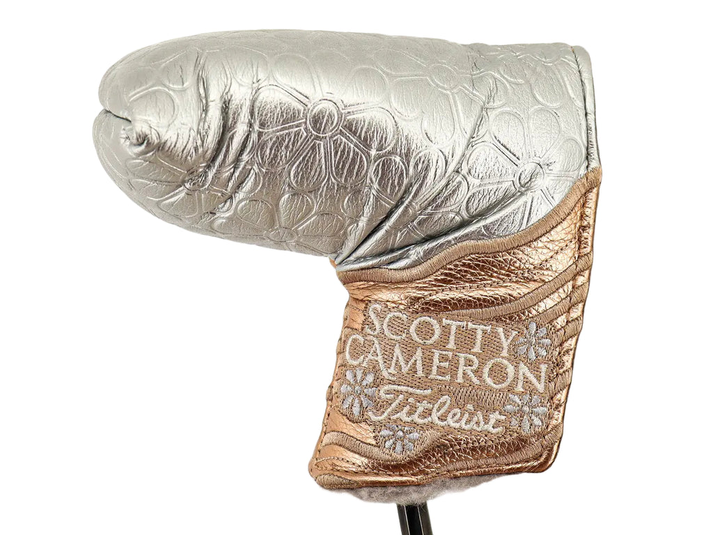 Silver and gold golf club head cover with 'Scotty Cameron' branding on a white background
