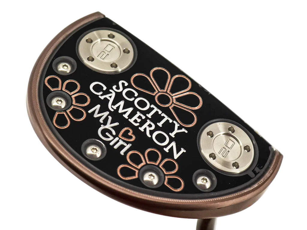 Scotty Cameron putter head with decorative elements on a white background